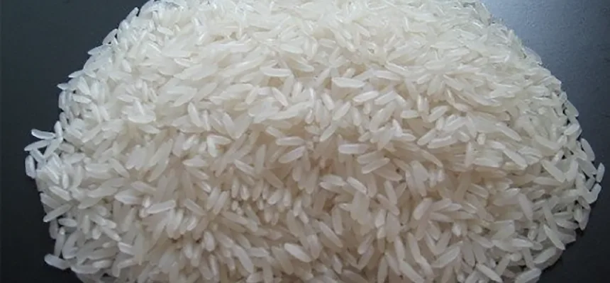 Thai White Rice 100% Broken — uncooked grains shown close up